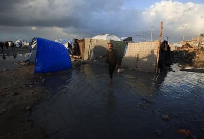Six dead as Gaza’s displaced struggle to hold ground in torrential rain