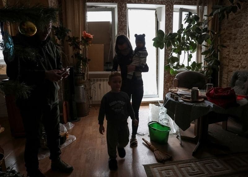 Kyiv residents grapple with cold after Russian strike rips open apartments