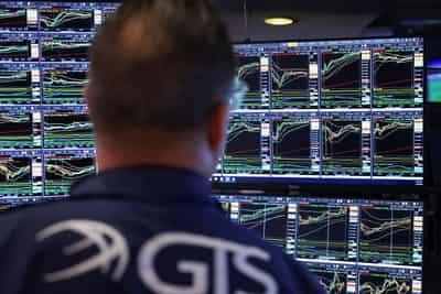 Image for Stocks rise, yields and dollar fall after Fed cuts interest rates 