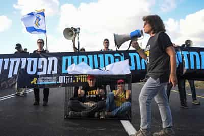 Image for Families leave Gaza City after night of bombardment, Israelis protest