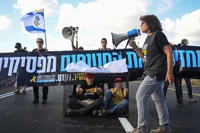 Image for Families leave Gaza City after night of bombardment, Israelis protest