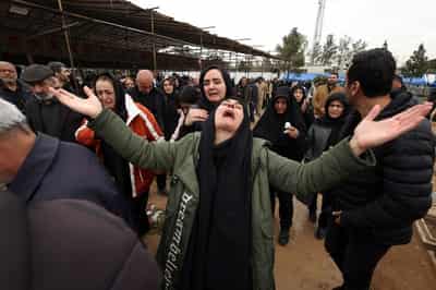 Image for Iranian families weep as war dead are buried in Tehran cemetery