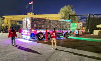 Image for Aid trucks roll into Gaza as Hamas hands over more hostage bodies