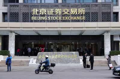 Image for China stimulus pushes global shares to new peak, boosts commodities