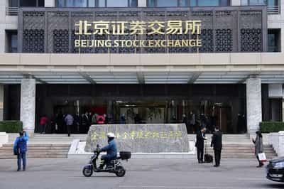 Image for China stimulus pushes global shares to new peak, boosts commodities