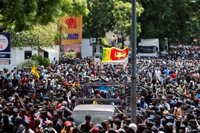 Image for Sri Lankans storm prime minister’s office, demanding he quit as well