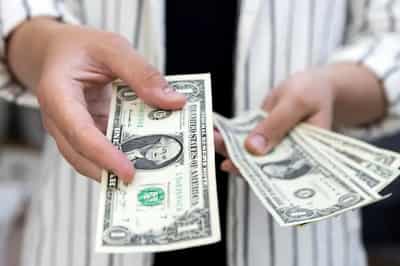 Image for Dollar edges lower in choppy trading after Fed rate cut