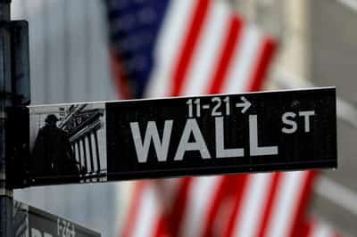 Image for Wall Street rallies, dollar dips on solid earnings, UK policy U-turn