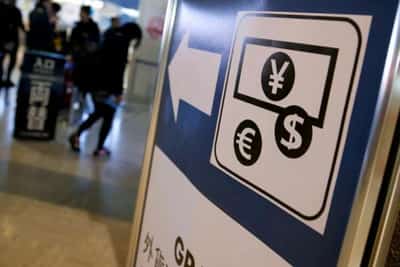 Image for Dollar up, euro down as pair face off in rate hike tussle