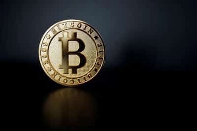 Image for Tepid start to week for world stocks, but gold, bitcoin shine