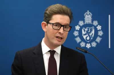 Image for UK spy chief warns of AI danger, though not disaster-movie doom