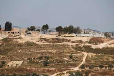 Image for Settlers force re-burial of Palestinian man in West Bank, family says