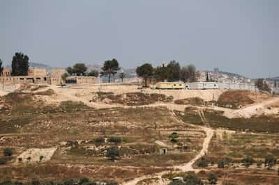 Image for Settlers force re-burial of Palestinian man in West Bank, family says