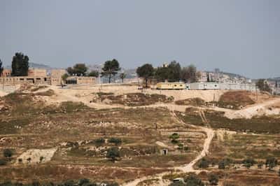 Image for Settlers force re-burial of Palestinian man in West Bank, family says