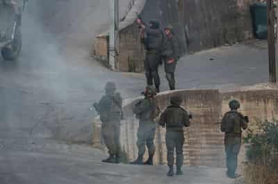 Image for Israeli military cracks down on West Bank village as settlers march in