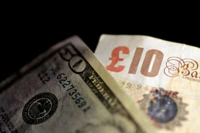 Image for Pound plumbs month&#8217;s low as stock rout hits risk currencies