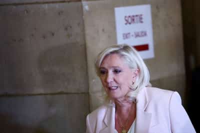 Image for French court shortens Le Pen's ban from office but orders electronic tag