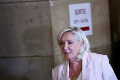 Image for French court shortens Le Pen's ban from office but orders electronic tag
