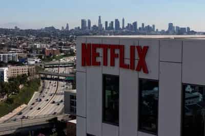 Image for Factbox-By the numbers: How the Netflix, Paramount bids for Warner Bros stack up