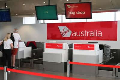Image for Virgin Australia says high staff illness rates hampering capacity, lifting fares