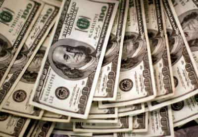 Image for U.S. dollar rises against most currencies ahead of Fed minutes