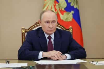 Image for Putin says Russia is curbing economic growth to control inflation, recession 'far away'