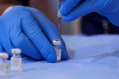 Image for As Delta spreads, some travelers double up on COVID-19 vaccine in U.S