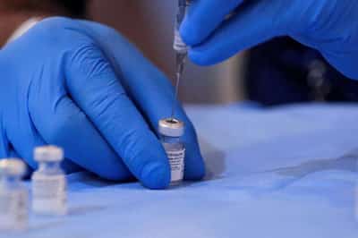 Image for As Delta spreads, some travelers double up on COVID-19 vaccine in U.S