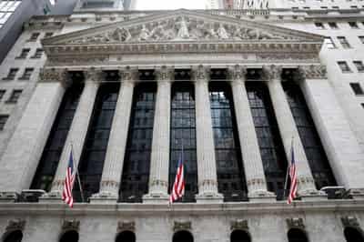 Image for Wall St falls on capital tax increase angst; dollar rises