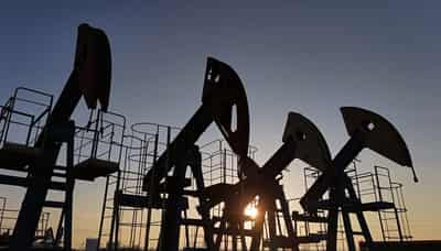 Image for Oil prices settle up as US begins holiday weekend