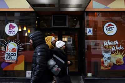 Image for Yum beats sales estimates as customers flock to KFC, Taco Bell deals