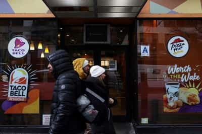 Image for Yum beats sales estimates as customers flock to KFC, Taco Bell deals