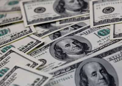 Image for Dollar near one-week high as traders prepare for Powell, payrolls tests