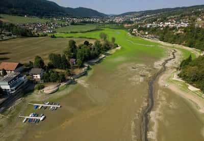 Image for Drought leaves Swiss border lake popular with tourists all but drained