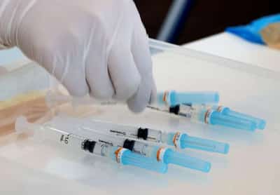 Image for Japan eyes mixed use of COVID-19 shots to speed vaccine rollout