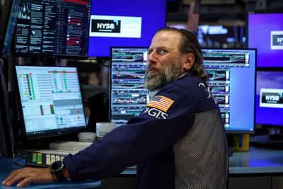 Image for Trading Day: Fed hopes lift stocks, clip dollar