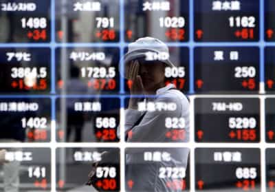 Image for Asian shares climb, oil holds gains as markets eye Iran talks, central bank moves