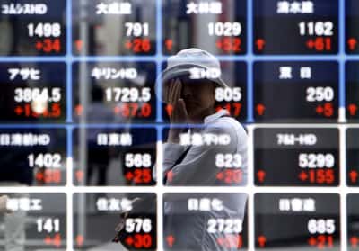 Image for Asian shares climb, oil holds gains as markets eye Iran talks, central bank moves