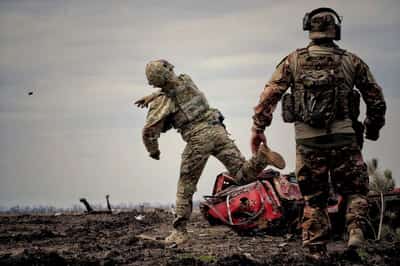 Image for South Africa says most of a group of 17 men lured into fighting for Russia set to return home