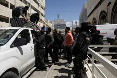 Image for At Beirut hospital, grieving families identify mangled bodies after Israeli strikes