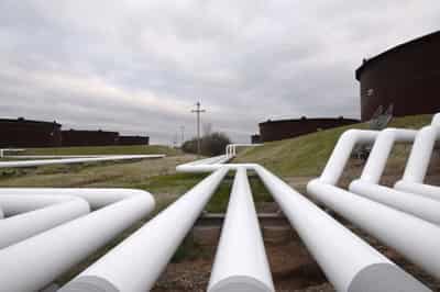 Image for Oil prices little changed, coronavirus, floods threaten demand