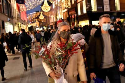 Image for Heavy winter sweaters, coats pile up at stores as warm weather threatens holiday shopping season