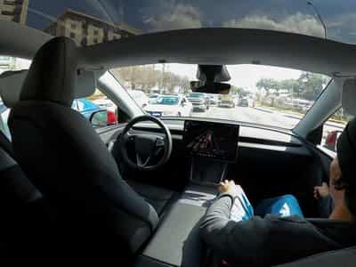 Image for Tesla's once-bullish tone on robotaxis shifts  