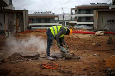 Image for Portugal's migrant curbs hit construction firms working to solve housing crisis