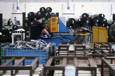 Image for China economy under pressure as factory output, retail sales growth slow sharply
