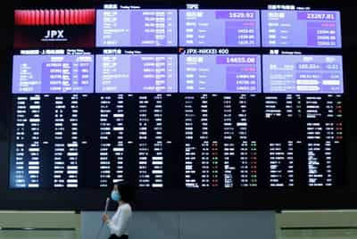 Image for Asian shares up, dollar wallows as Fed soothes inflation fears