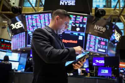 Image for Investors raise risk bets but cash flashes 'sell signal' - BofA survey