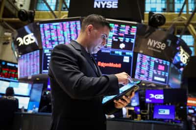 Image for Investors raise risk bets but cash flashes 'sell signal' - BofA survey
