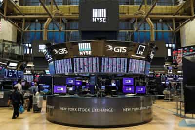 Image for Global Markets: Stocks touch new highs as volatility eases, dollar gains