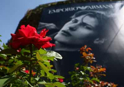 Image for A lone red rose outside Armani as Milan mourns its 'king' of fashion